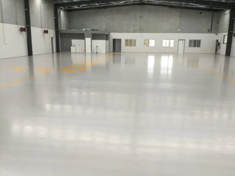 Plain coat epoxy floor in light grey, commercial space, Melbourne