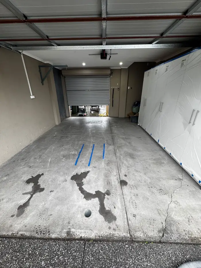Before — stained bare concrete garage, Mill Park
