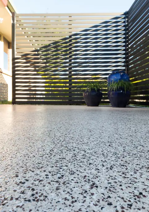 Flake epoxy patio in a warm terracotta blend