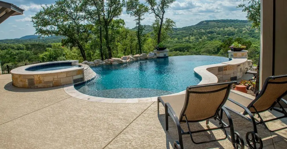 Resurfaced pool deck in sandstone texture, finish reference