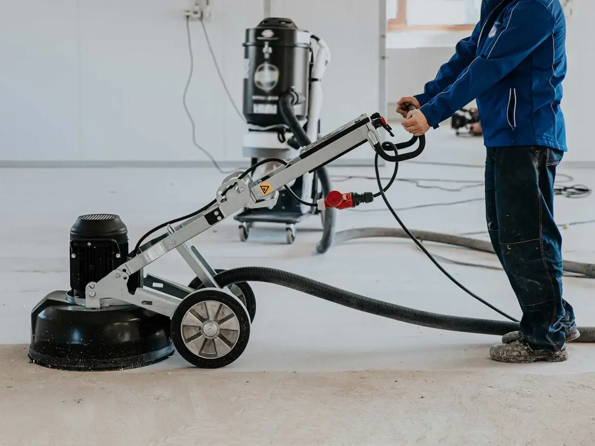 Planetary grinder and dust extractor preparing commercial slab, project reference
